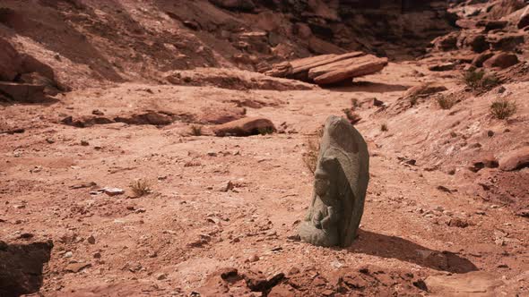 Ancient Statue on the Rocks Desert