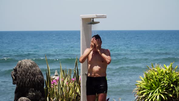 Man and Shower on the Beach