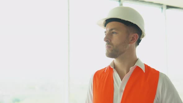 Portrait of an Engineer Architect Standing on the Construction Site