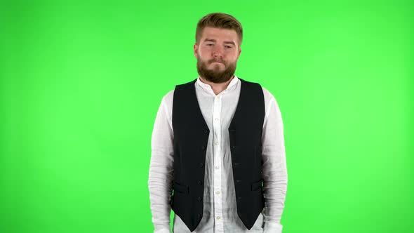 Upset Man Shrugs and Shakes His Head Negatively. Green Screen