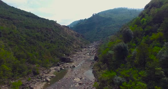 Long view of a river in mountains.