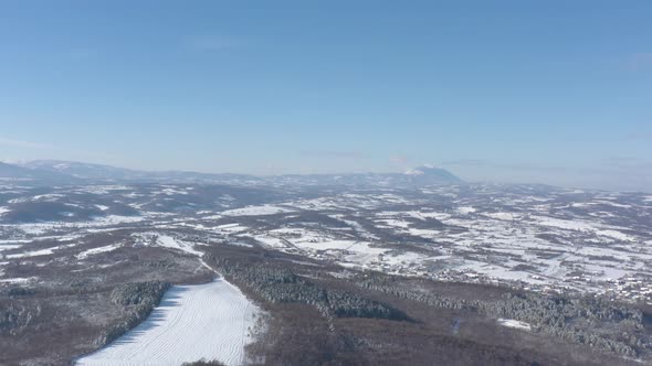 Winter scenery with Rtanj mountain on sunny day 4K aerial video