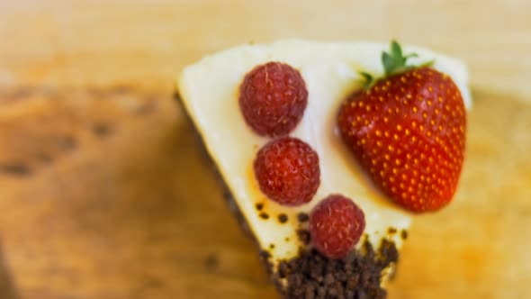 A Slice of Strawberry and Raspberry Cake and Slices Pressed with Chocolate