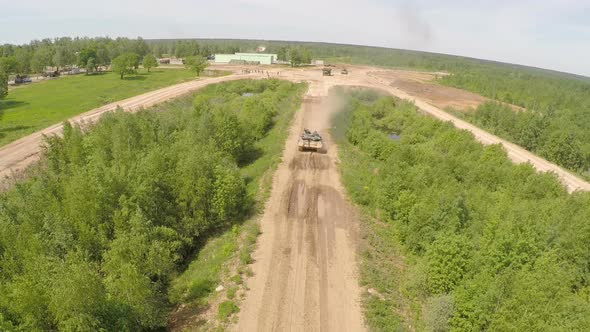 Flying Over the Tank on Rough Ground of Training Area