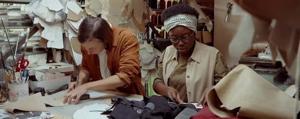 Multiethnic Female Shoemakers Working Together in Workshop