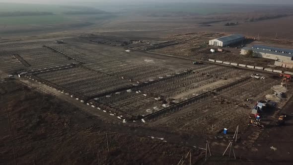 Aerial Landscape Footage of a Massive Solar Power Station Construction Site