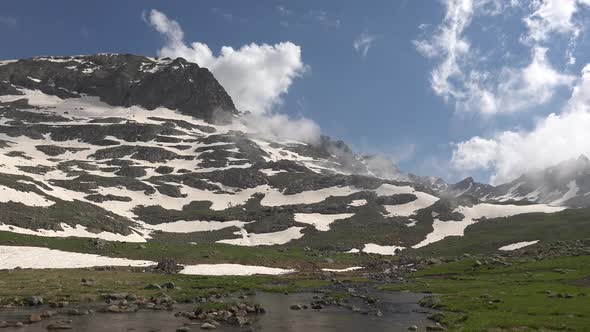 Panoramic Alpine Meadow and Stream in High Altitude Mountain