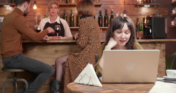 Young Woman Engaged in an Online Conversation