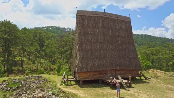 Flycam Shows Traditional Wooden House with High Narrow Roof