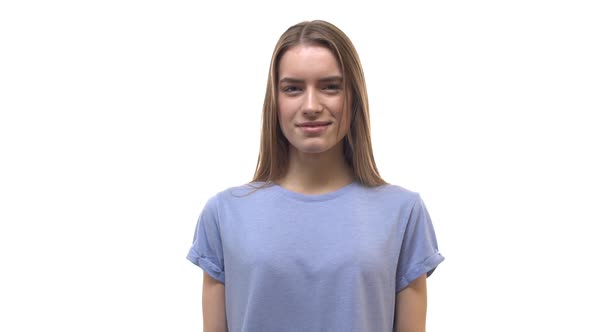 Slow Motion Gorgeous Blonde European 20s Girl Wearing Blue Tshirt Start Smiling Laughing Out Loud