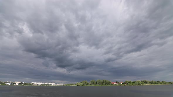 The Sky Over The River Is Covered With Thick Clouds