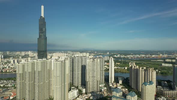 aerial crane shot from Binh Thanh district looking onto modern developments and across the Saigon Ri