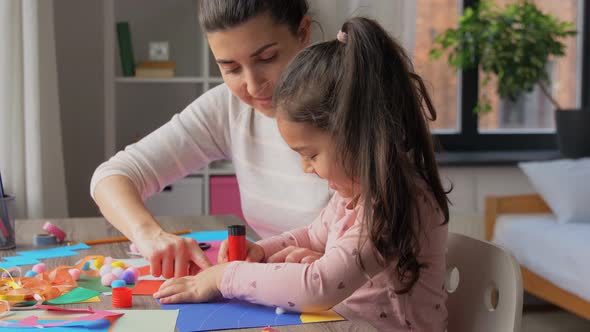 Daughter with Mother Making Applique at Home