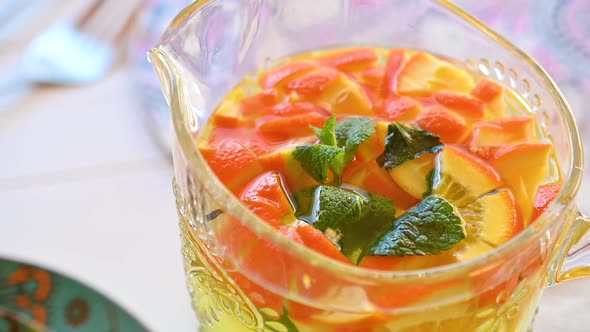 Orange Lemonade in a Decanter on the Table