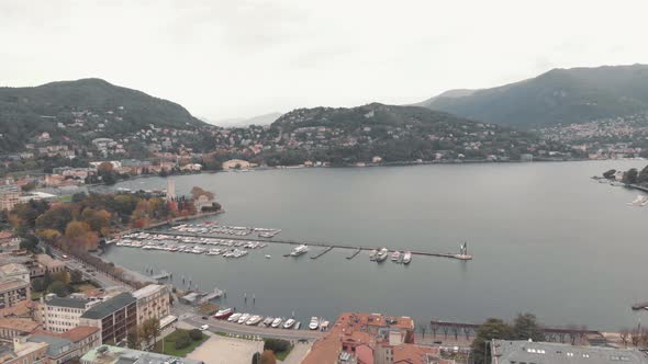Yachts and boats moored at Lake Como marina, Lombardy. Aerial establisher