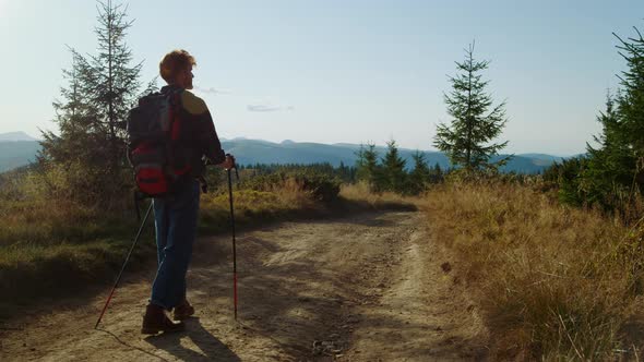 Ginger Man Hiking on Mountain Road