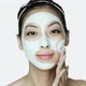 Young woman applying face mask - VideoHive Item for Sale