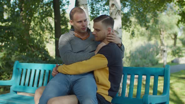 Loving Homosexual Partners Bonding on Park Bench