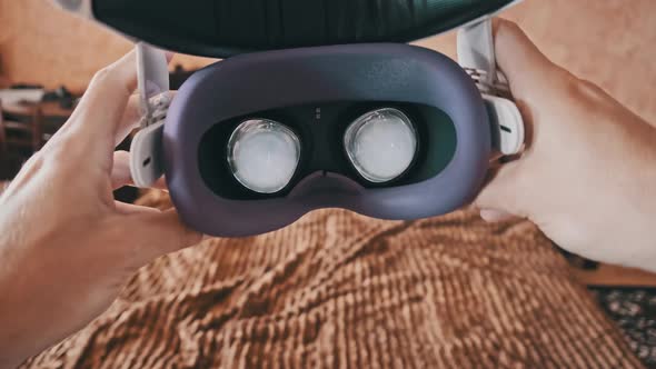 POV of Putting on VR Glasses Virtual Reality in the Bedroom