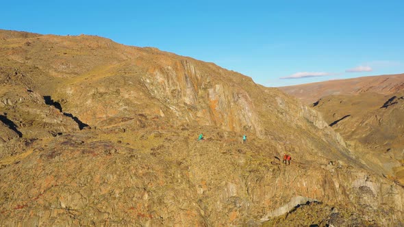 Photographers in Mountains at Sunset. Aerial View. The Altai Mountains, Russia