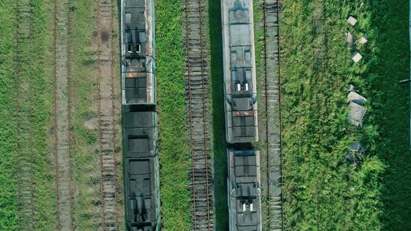 Aerial Top Down Shot of an Abandoned Rusty Locomotives and Old Railways