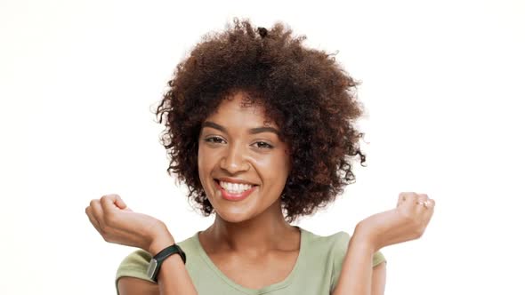 Surprised Young Beautiful African Girl Laughing Over White Background