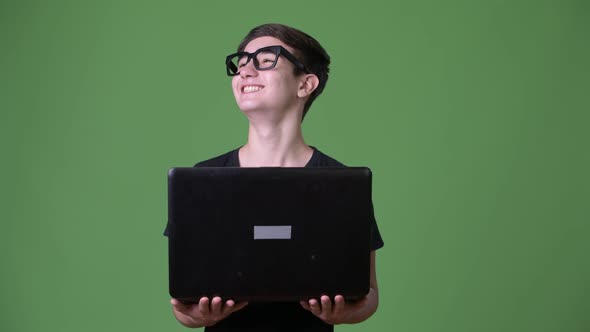 Young Handsome Iranian Teenage Boy Against Green Background