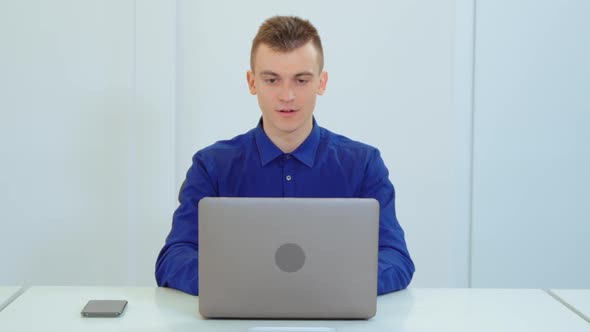 Front View Face Employee Happy About Win in Startup Office