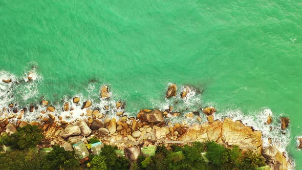 Daytime fly over copy space shot of a white sand paradise beach and aqua turquoise water background 