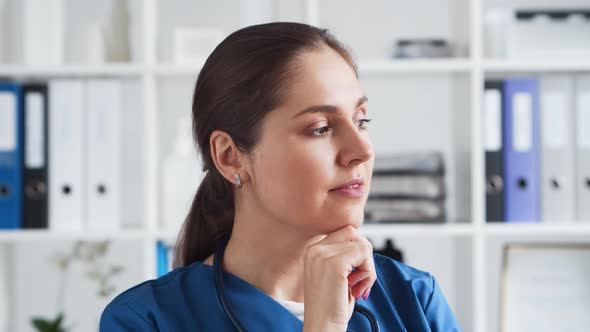 Professional medical doctor working in hospital office. Young and attractive female physician.