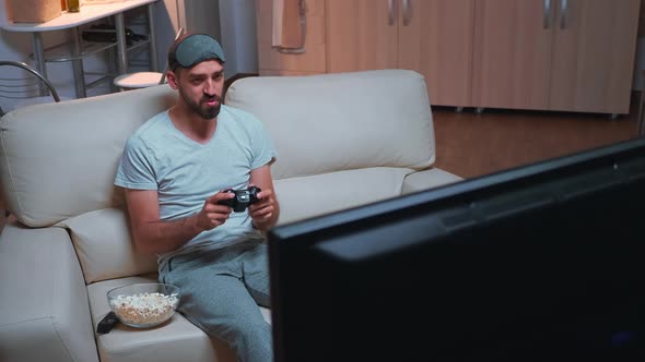 Disappointed Gamer Playing Soccer Videogame During Gaming Competition