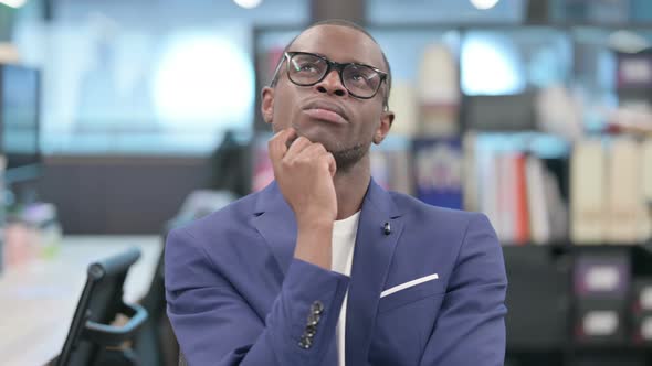 Portrait of Pensive Young African Businessman Thinking