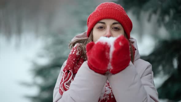 Woman Blowing Snow