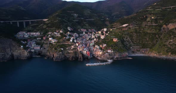 Houses of quaint Riomaggiore on steep coastal hillside, Cinque Terre, Italy