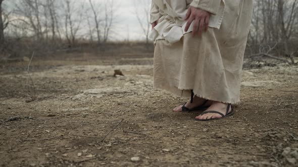 Closeup Of A Religious Man Kneeling To Pray