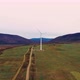 Lonely windmill in the field between Carpathian mountains of Ukraine in spring. - VideoHive Item for Sale