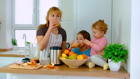 The Family Prepares Smoothies at Home