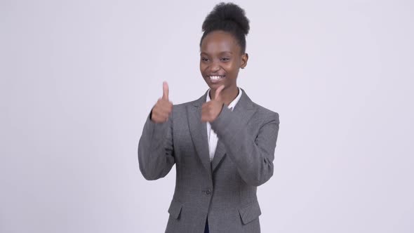 Young Happy African Businesswoman Looking Excited and Giving Thumbs Up