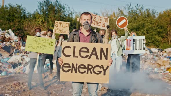 Portrait of Young Man Activist With a Poster Calling to Take Care of the Environment