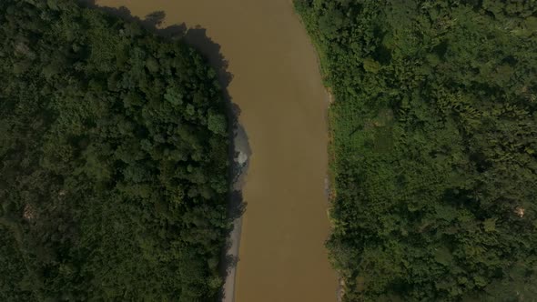 Topdown View Of Forest River Near Indigenous Village In The Amazon Of Ecuador. Aerial Shot