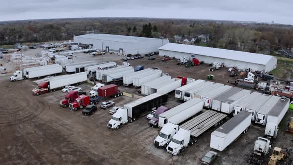Aerial Drone View of Truck Repair Shop Service Building and Many Trucks Near It