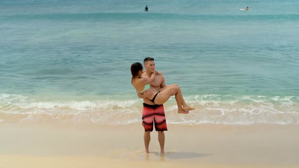 Couple kissing each other on the beach 4k