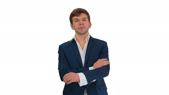Confident Young Businessman Raising Finger and Folding Arms Looking at Camera on White Background