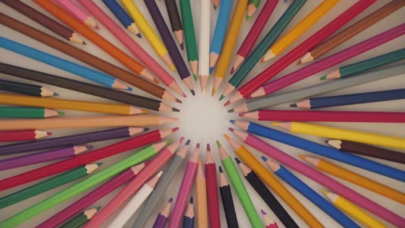 Colored Pencils on Paper Background. Creative Concept for Logo, Back to School 