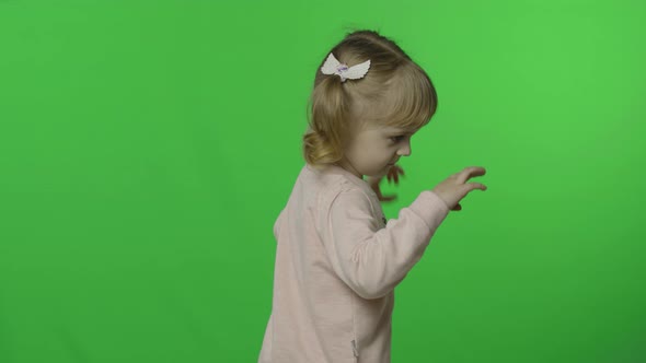 Girl in Unicorn Sweatshirt Make Faces and Smile