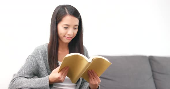 Woman Reading Book at Home