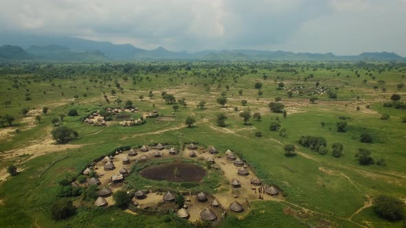 Aerial of Traditional African Village With homes made from wood and straw in Uganda, East Africa