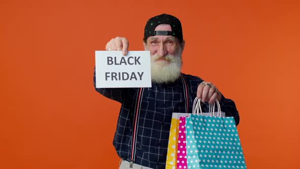 Elderly Bearded Man Showing Black Friday Inscription Banner Text Advertising Discounts Low Prices