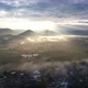 Landscape view of the city of rural village in valley on foggy day while the sun is raising by drone - VideoHive Item for Sale
