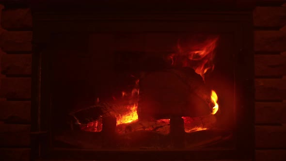 Wood Is Burning in Fireplace
